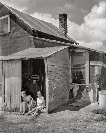 Photo showing: The Laundry Shed -- July 1941. Children of FSA borrower on cut-over land. Itasca County, Minnesota.