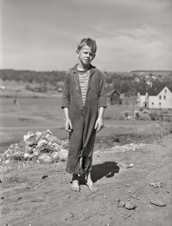 Photo showing: Askance -- August 1941. Boy who lives in Houghton, Michigan. Copper Range town.