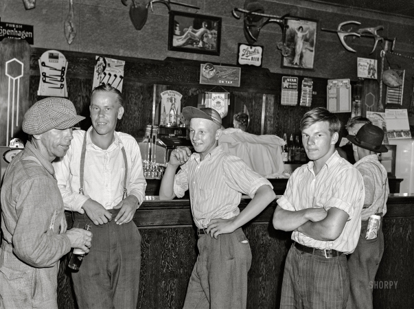 Photo showing: Sunday Skoal -- August 1941. Farm boys in beer parlor on Sunday afternoon. Finnish community of Bruce Crossing, Michigan.