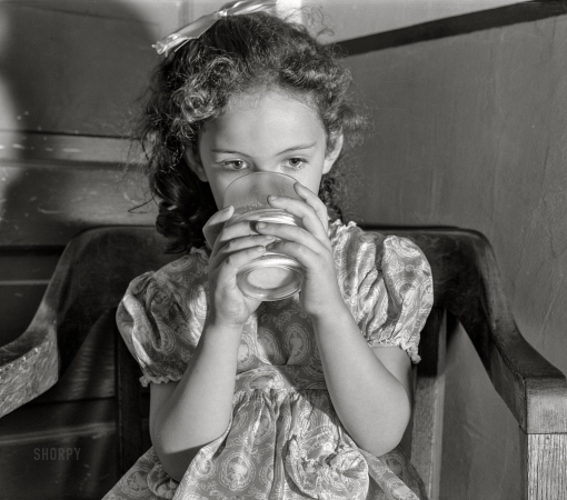 Photo showing: Milk Tot -- August 1941. Child drinking milk. Duluth, Minnesota.
