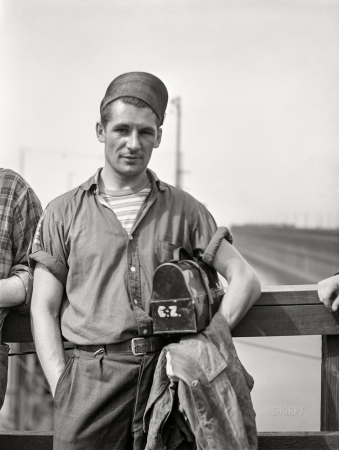 Photo showing: E.Z. -- August 1941. Ore puncher waiting for change of shift. Allouez, Wisconsin.