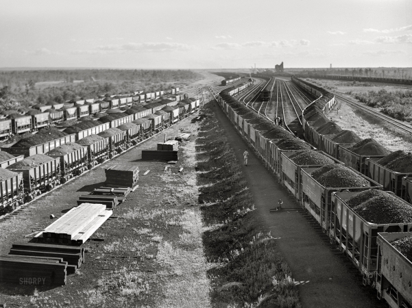 Photo showing: More Ore -- August 1941. Iron ore from the Minnesota Range in the Great Northern railyards at Superior, Wisconsin.
