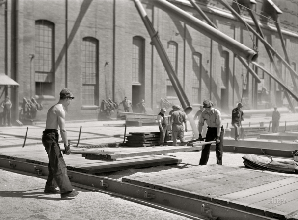 Photo showing: Wheat Spouts -- August 1941. Closing up hold of a grain boat. Superior, Wisconsin.