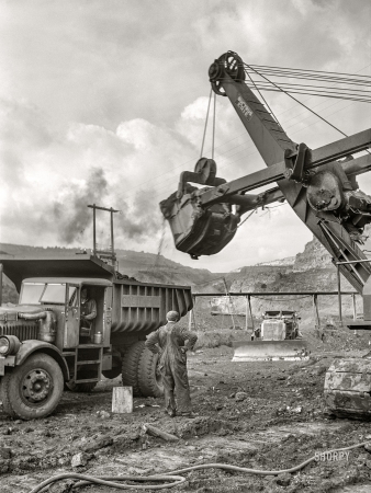Photo showing: Dart Dump Truck -- August 1941. Loading dump truck with iron ore at the Albany mine, Hibbing, Minnesota.