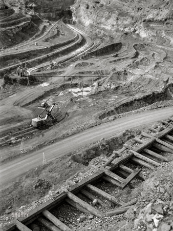 Photo showing: Albany Mine -- August 1941. Albany Mine, Hibbing, Minnesota. Iron ore from this mine is brought up by truck.