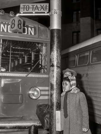 Photo showing: Night Coach -- Dec. 24, 1941. Washington, D.C. Greyhound bus terminal on Christmas eve. Little girl waiting.