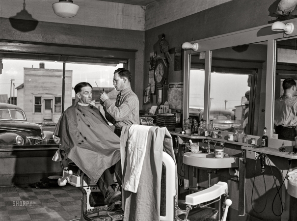 Photo showing: Dakota Clipper -- February 1942. Timber Lake, Dewey County, South Dakota. Barber shop.