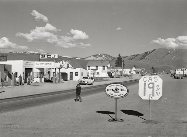 Photo showing: Grizzly Gas -- April 1942. Missoula, Montana. Entering the town.