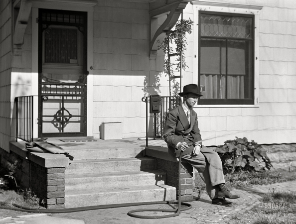 Photo showing: House and Hose -- May 1942. Watering the lawn in Grand Island, Nebraska.