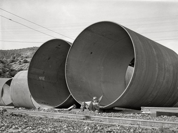 Photo showing: SuperPipe -- December 1941. Shasta County, California. Segments of penstock pipe which will be used
to conduct water from the reservoir formed by Shasta Dam to the hydroelectric turbines.