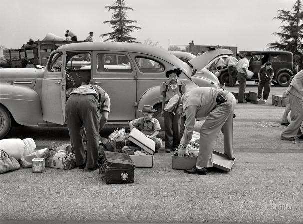 Photo showing: Santa Anita -- April 1942. Santa Anita reception center, Los Angeles. The evacuation of Japanese-Americans from West Coast areas
under United States Army war emergency order. Examining baggage of Japanese as they arrive at the center.