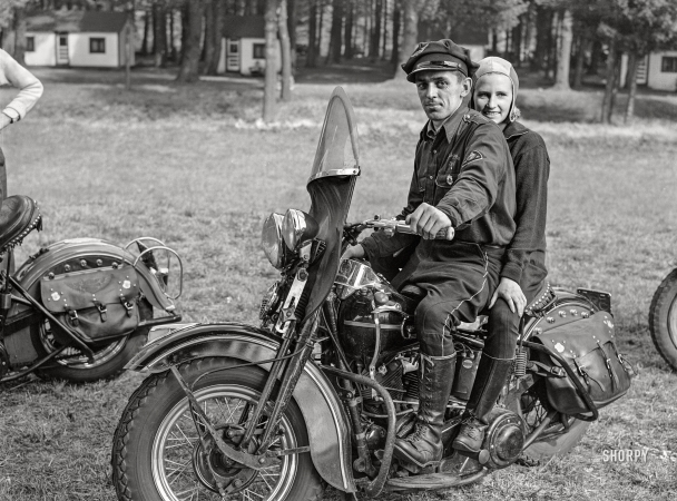 Photo showing: Motorcycle Mama. -- October 1941. Berkshire Hills County, Mass. Members of a motorcycle troop
out to enjoy the fall coloring along the Mohawk Trail through the Berkshires.