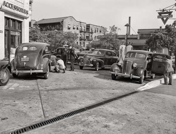Photo showing: Last Call - -- May 14, 1942. Washington, D.C. Filling up with gas on the day before rationing starts.