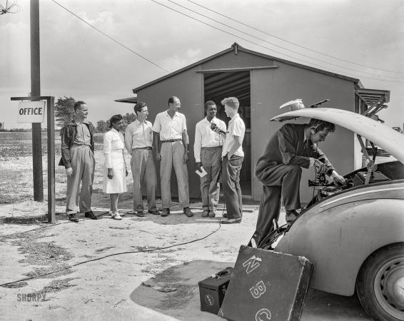 Photo showing: FSA to NBC -- June 1942. Bridgeton, New Jersey. FSA agricultural workers' camp.
National Broadcasting Company making a record for national use.