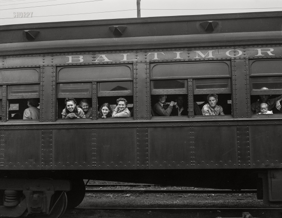 Photo showing: Tomato Express -- September 1942. Richwood, West Virginia. Trainload of
migratory workers bound for the harvest fields in New York state.