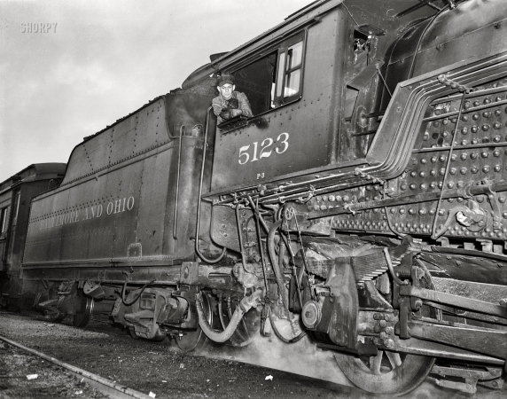 Photo showing: B&O -- September 1942. Richwood, West Virginia. An engineer on the Baltimore and Ohio Railroad.