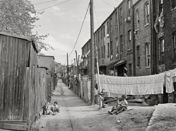 Photo showing: Hanging Out -- -- September 1941. Children playing in Defrees Alley N.E. near the Capitol building.