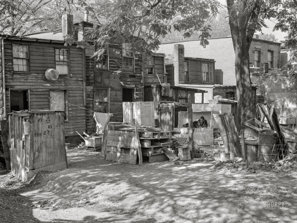 Photo showing: Low-Rent -- September 1941. Slum area near the U.S. Capitol, between D and C Streets off First Street S.W.