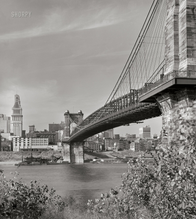 Photo showing: Roebling Bridge -- Spring 1941. View under Roebling Suspension Bridge of Cincinnati from Kentucky side of the Ohio River.