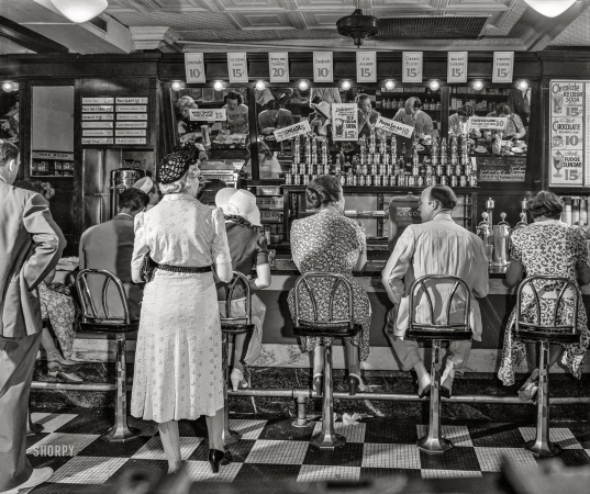 Photo showing: Lunch Meet -- July 1942. Lunchtime in the wartime capital. People's Drug store on G Street N.W. at noon.