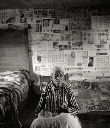 Photo showing: Former Slave -- May 1941. Mulatto ex-slave in her house near Greensboro, Alabama.