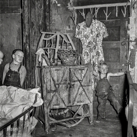 Photo showing: Stick House -- September 1938. Homemade caned furniture in bedroom of coal miner. A company house. Pursglove, Scotts Run, West Virginia.