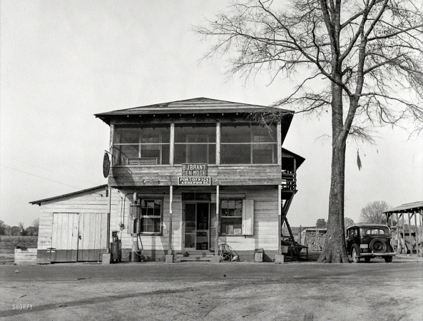 Photo showing: Ashepoo P.O. -- December 1938. General store and post office, sawmill town. Ashepoo, South Carolina.