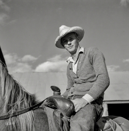 Photo showing: Our Man in Montana -- August 1941. Cowboy in the corral at Quarter Circle U, Brewster-Arnold Ranch Company. Birney, Montana.