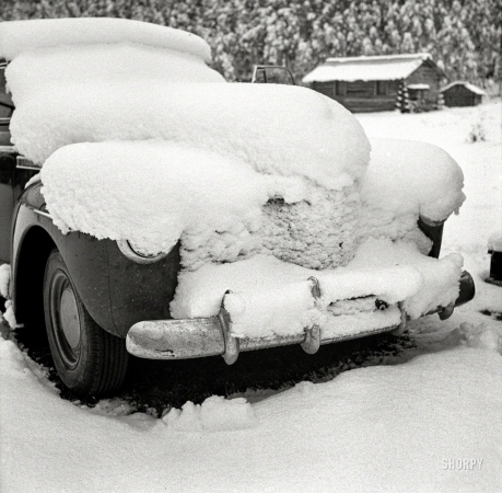 Photo showing: The Driven Snow -- September 1941. Car covered with snow after early fall blizzard on ranch in mountains near Aspen, Colorado.