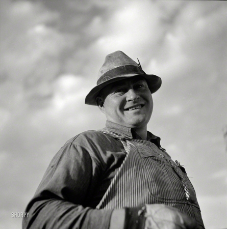 Photo showing: Jolly Rancher -- September 1941. Frank E. Hagemeister, treasurer of the cooperative
association on Scottsbluff Farmsteads, Farm Security Administration project.
