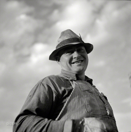 Photo showing: Jolly Rancher -- September 1941. Frank E. Hagemeister, treasurer of the cooperative
association on Scottsbluff Farmsteads, Farm Security Administration project.