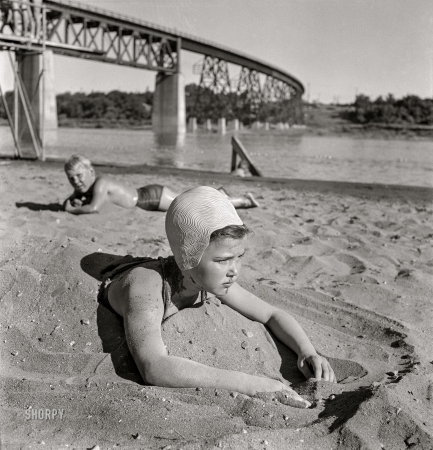 Photo showing: Beached -- -- June 1942. Redding, California. Youngsters at the beach, Sacramento River.