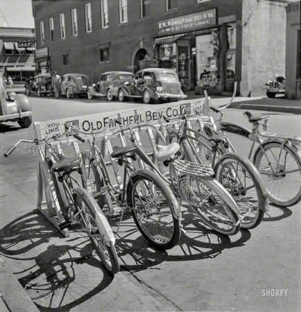 Photo showing: You Like It -- August 1942. Bike rack in Idaho Falls, Idaho.