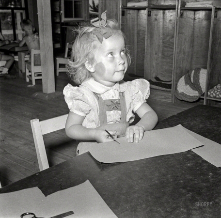 Photo showing: Please, I'm Busy! -- May 1942. Childersburg, Alabama. Defense worker's child in WPA day nursery.