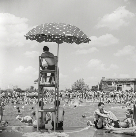 Photo showing: Sunday Swimmers -- July 1942. Washington, D.C. Sunday swimmers at the municipal swimming pool.