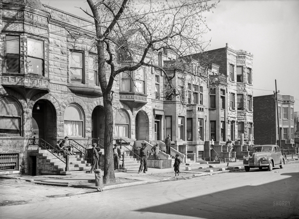 Photo showing: Second City -- April 1941. Old brownstone houses now occupied by Negroes in Chicago, Illinois.