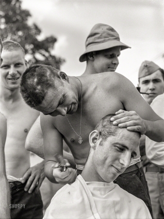 Photo showing: Bad Haircut Day -- June 1941. Hattiesburg, Mississippi. Getting a haircut at Camp Shelby.