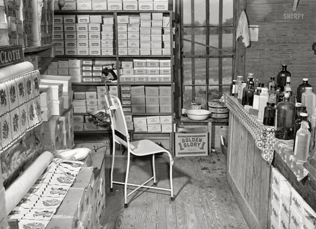 Photo showing: Wel-Mart -- May 1940. Doctor's office in rear of country store. Faulkner County, Arkansas.