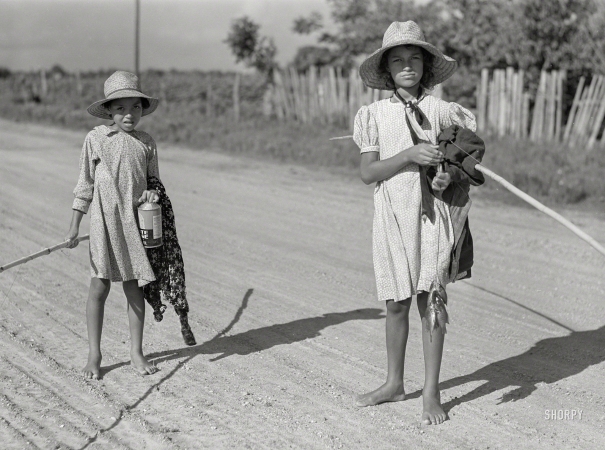 Photo showing: Small Fry. -- June 1940. Melrose, Natchitoches Parish, Louisiana. Children of
mulatto family returning home after an afternoon fishing in Cane River.