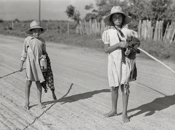 Photo showing: Small Fry. -- June 1940. Melrose, Natchitoches Parish, Louisiana. Children of
mulatto family returning home after an afternoon fishing in Cane River.