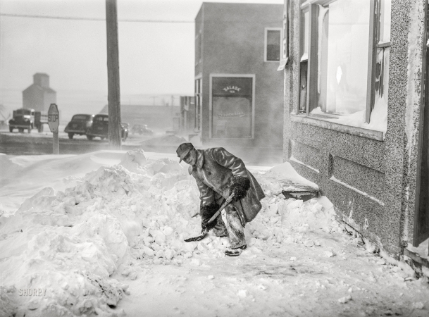 Photo showing: Chill Out -- November 1940. Shoveling snow. Draper, South Dakota.