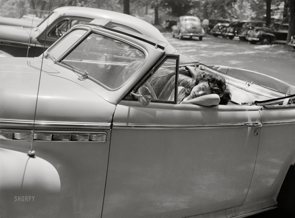 Photo showing: Asleep at the Wheel -- July 1942. Washington, D.C. Sunday in Rock Creek Park. Girl sleeping in a car.