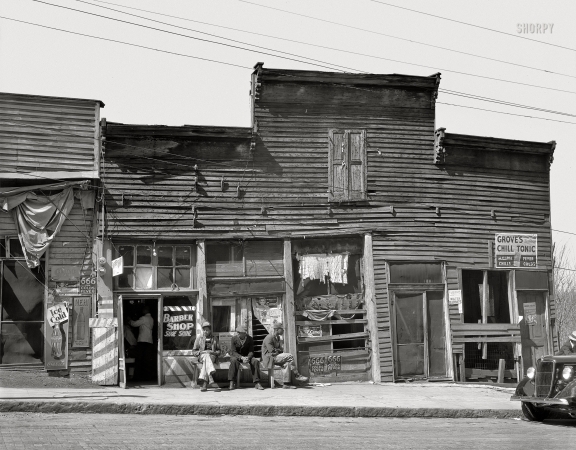 Photo showing: Strop Mall -- March 1936. Warren County, Mississippi. Vicksburg Negroes and shop fronts.