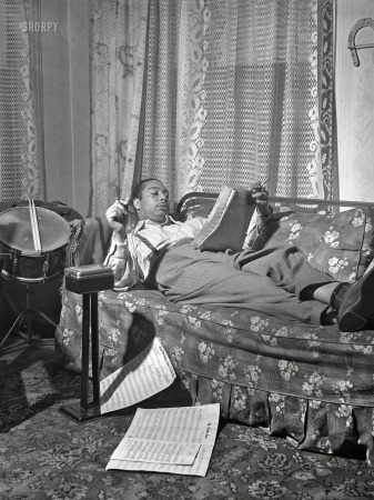 Photo showing: Beat Me Daddy, Eight to the Bar -- April 1942. Mr. Oliver Coleman, drummer, in the study of his apartment. Chicago, Illinois.