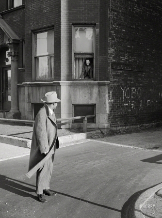 Photo showing: Private Alley -- April 1942. Chicago. Bandleader 'Red' Saunders stops to say goodbye to his wife.