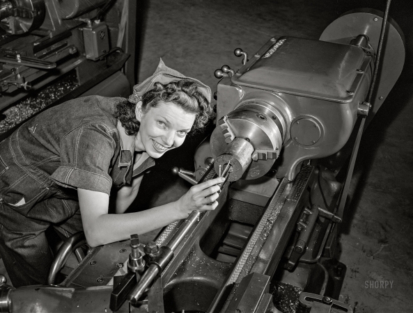 Photo showing: Lady of the Lathe -- June 1942. Knoxville, Tennessee. Teen-age girl training
for defense work at a National Youth Administration school.