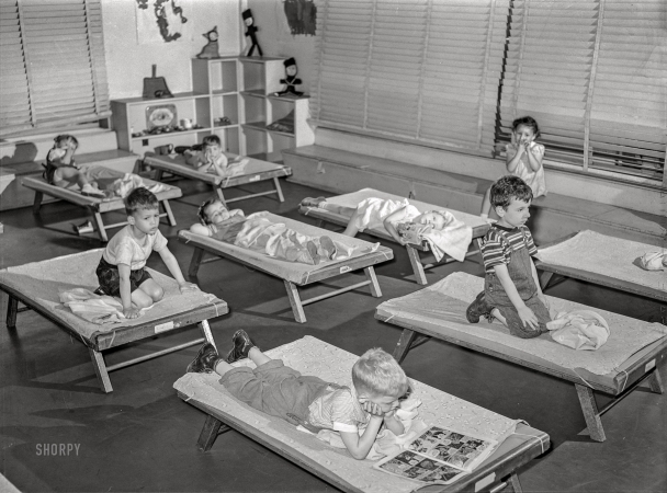 Photo showing: Cot Napping -- June 1942. Queens, New York. Nursery school at Queensbridge
housing project. Children listening to music during rest period.