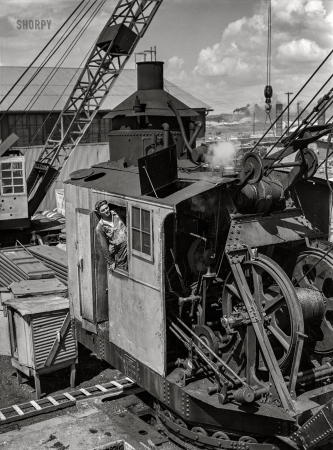 Photo showing: Crane Man -- July 1942. Decatur, Alabama. Ingalls Shipbuilding Company. A crane operator.