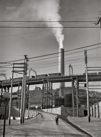 Photo showing: Copper Country. -- September 1942. Deer Lodge County, Montana. Anaconda smelter. Ore cars and smokestack.