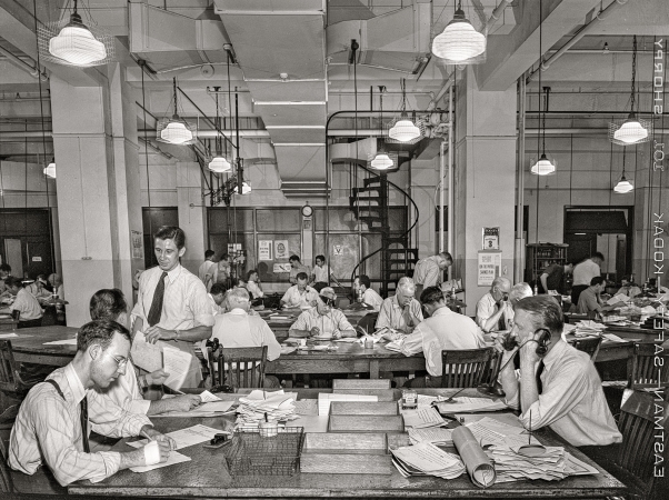 Photo showing: The Newsroom -- September 3, 1942. New York, New York. Newsroom of the New York Times newspaper.